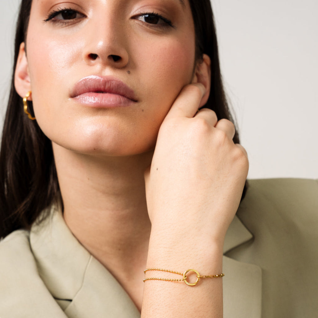 Zlatý náramek s tenisovou krabičkou